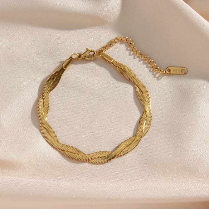 Embrace timeless elegance with the Aurelia Bracelet—a captivating blend of waterproof sophistication and gold-plated allure, crafted to adorn your wrist with a modern poetic grace.
