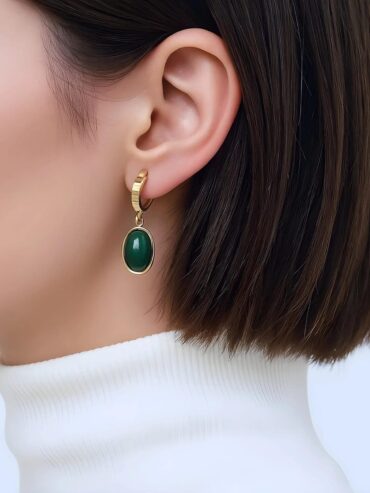 Experience the delicate fusion of ancient elegance and modern luxury. The Golden Jade Earring dances gracefully, its radiant glow a tribute to timeless beauty and refined artistry, perfect to adorn every look with an air of enchanting mystique.