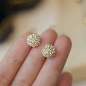 Indulge in the allure of the Elise Pearl Stud Earrings—where luminous pearls whisper secrets of moonlit beauty and timeless grace in every delicate curve.