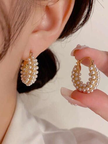 Let the Aria Pearl Earrings adorn your elegance, their vintage allure and delicate curve weaving timeless poetry. Each pearl whispers secrets of refined beauty, a symphony of grace to cherish every moment.