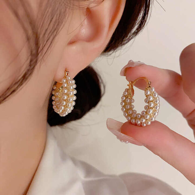Let the Aria Pearl Earrings adorn your elegance, their vintage allure and delicate curve weaving timeless poetry. Each pearl whispers secrets of refined beauty, a symphony of grace to cherish every moment.