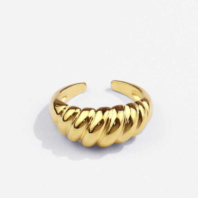 Embrace the allure of artistry with our Croissant Ring—where gleaming silver and golden whispers intertwine in a dance of delicate elegance. A timeless treasure that captures the essence of modern romance.